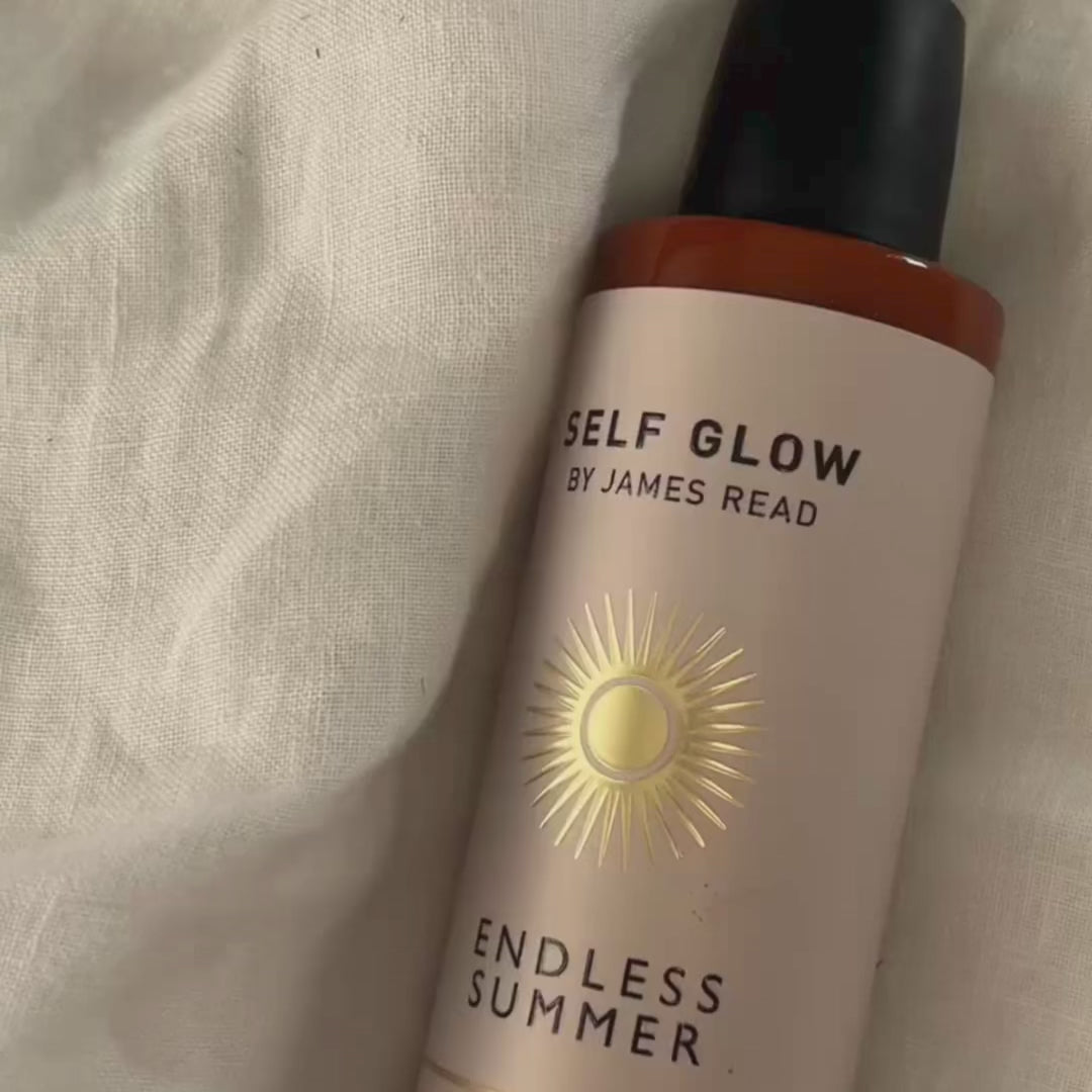 A video of a woman applying Self Glow by James Read  Gradual Tan Moisturiser to her body and face revealing a beautiful golden glow and nourished skin after application