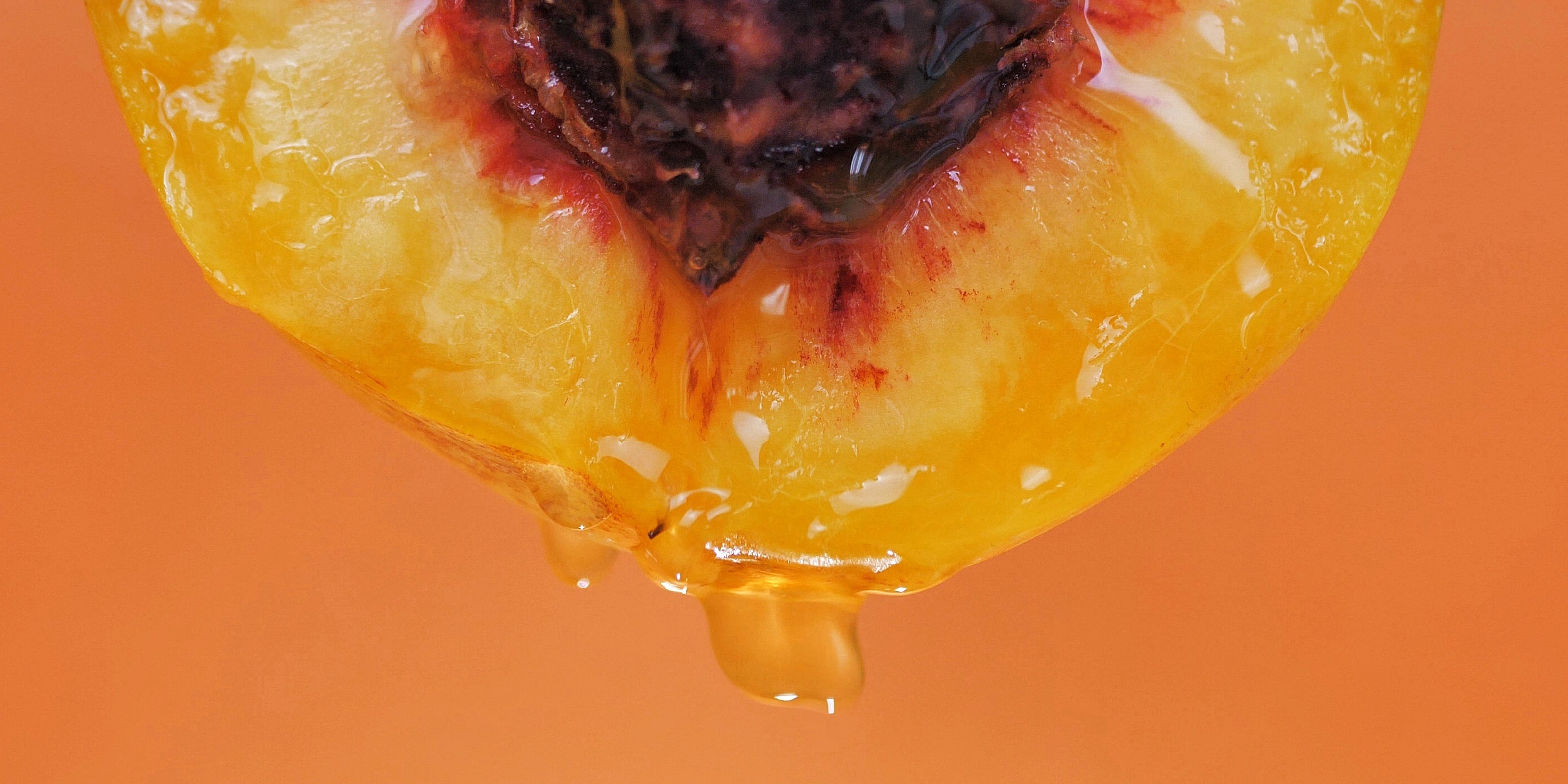 A close-up image of an apricot, a featured ingredient in the Self Glow by James Read Endless Summer Body sunless tanning product for a natural-looking fake tan.